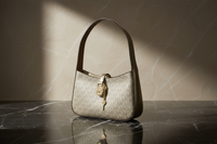 Michael Kors guldfärgad tygväska